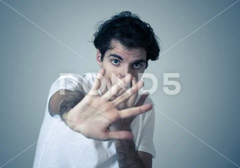 Close up portrait of concern scared shocked adult man with a terrified facial Stock Photos