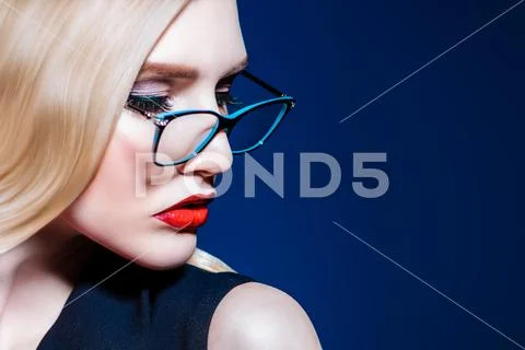 A close up portrait of a confident lady wearing glasses. Beauty, make-up, sty Stock Photos