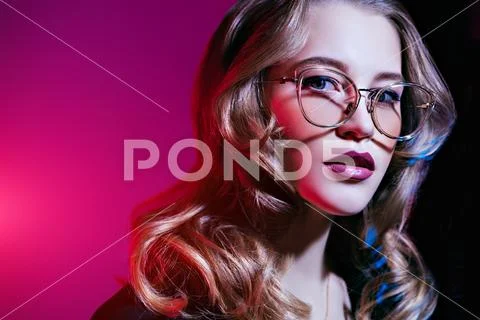 A close up portrait of a confident lady wearing glasses. Beauty, make-up, sty Stock Photos