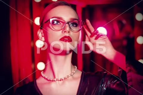 A close up portrait of a confident lady wearing glasses. Beauty, make-up, sty Stock Photos