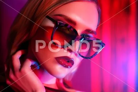 A close up portrait of a confident lady wearing glasses. Beauty, make-up, sty Stock Photos