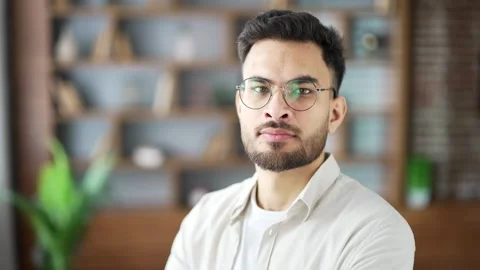 Close up portrait of confident serious young man wearing glasses stands  Stock Footage 296579181