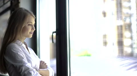 Close-up portrait of confident woman in white shirt standing with arms crossed Stock Footage