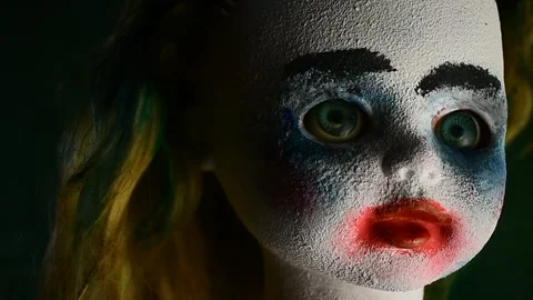 Close-up portrait of a creepy doll, slightly moving to the right of the camera Stock Footage 138862995