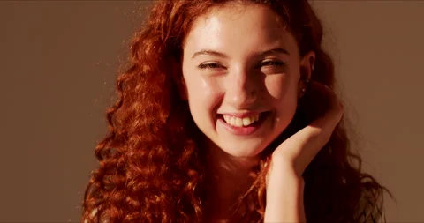 Close up portrait of cute charming face of young woman model with red curly hair Видео 138711868