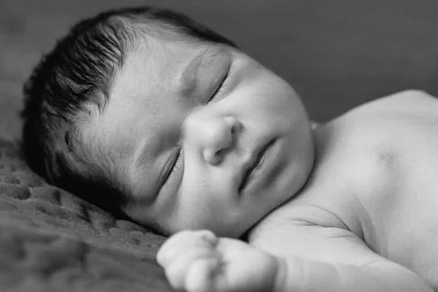 Close up portrait of a cute two weeks old newborn baby girl without clothes Stock Photos