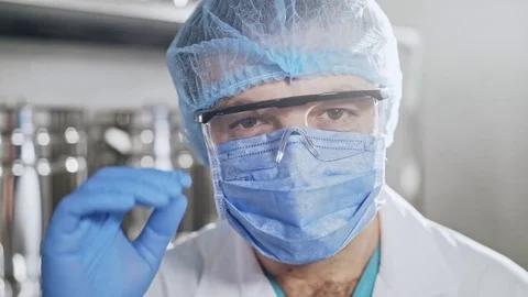 Close-up portrait of a dedicated and happy surgeon Stock Footage 84312792