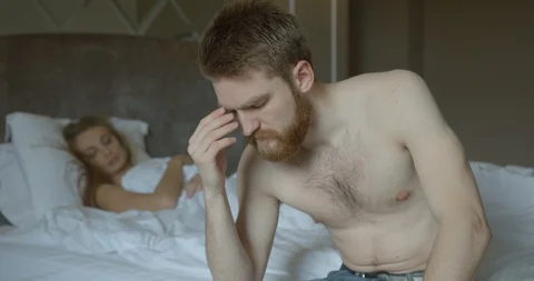 Close-up portrait of the depressed ginger head man is worrying about problems in Stock Footage 86376970