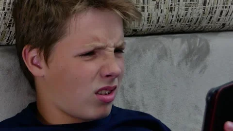 Close-up portrait of a disgruntled boy. Stock Footage 141916176