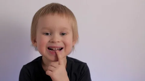 Close up portrait of doubt little cute child feeling confused hesitate and Stock Footage 125437313