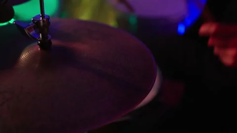 Close Up Portrait of Drummer Playing Drums, colored lights Stock Footage 235511950