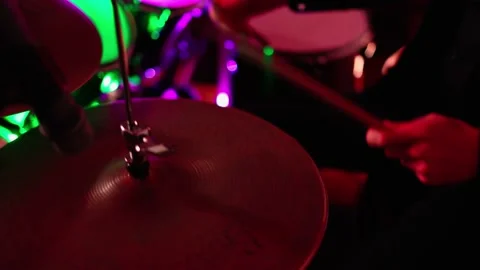 Close Up Portrait of Drummer Playing Drums, colored lights Stock Footage 235512112