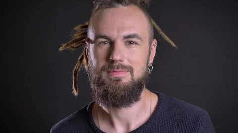Close-up portrait of eccentric caucasian man showing positive amusement and Video stock 100343068