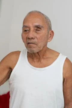 Close up portrait of elderly man with visual disability showing thoughtful .. Фото