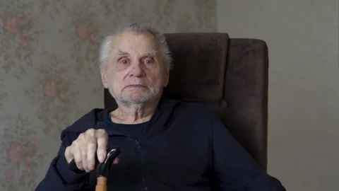 Close-up Portrait of an Elderly Man with Walking Stick Stock Footage 306084900