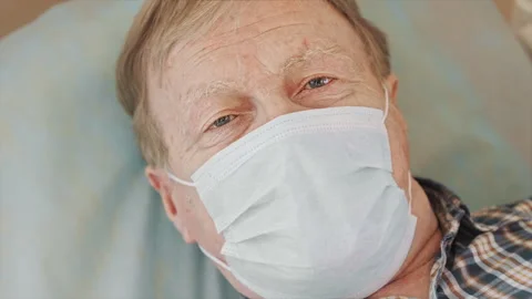 Close-up portrait of an elderly man wearing a medical mask. Stock Footage 302175133