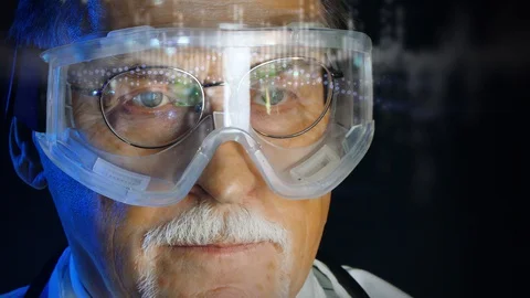 Close up portrait elderly scientist in high tech laboratory Stock Footage 129284570