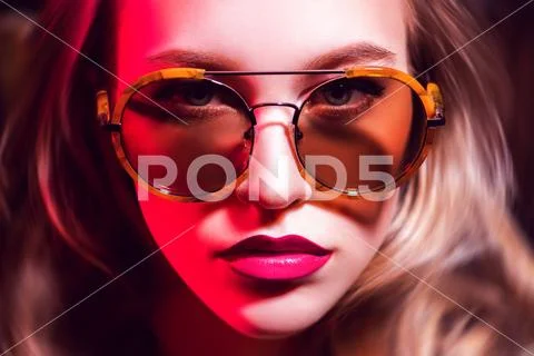 A close up portrait of an elegant lady wearing sunglasses. Beauty, make-up, s Stock Photos