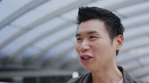 Close up portrait of face Charming Asian man with short hair are confident Stock Footage 159750259