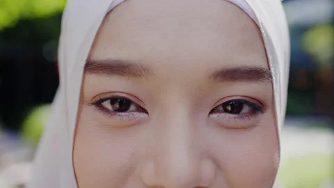 Close up portrait of face Charming Asian teenager Muslim woman are eyes Video stock 160416848