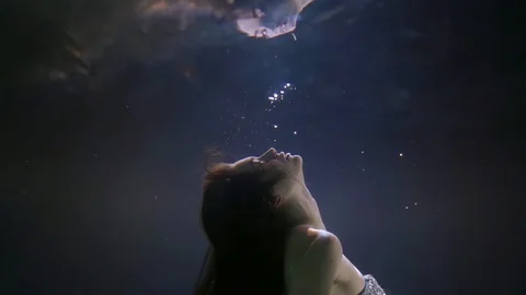 Close-up portrait of a face in profile of a dark-haired girl with rhinestones on Stock Footage 121728550