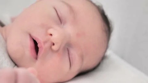 Close-up portrait of the face of a sleeping newborn baby in macro Video stock 232924848