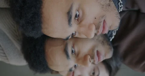 Close-up portrait of faces of sad and pensive man and woman reflecting in mirror Stock Footage 237699577