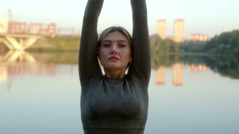 Close up portrait fit slender athletic young woman with blonde ponytail does Stock Footage 220757076
