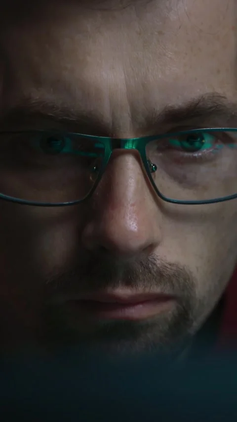 Close-up portrait of a focused coder working at night Stock-Footage 345446265