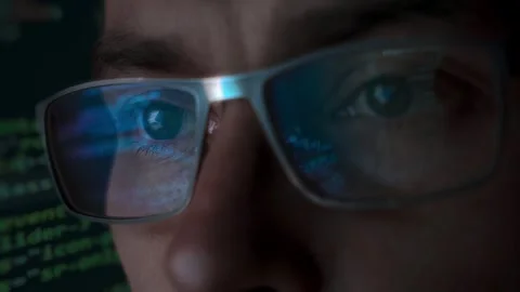 Close-up portrait of focused software engineer wearing eyeglasses 스톡 동영상 294056518