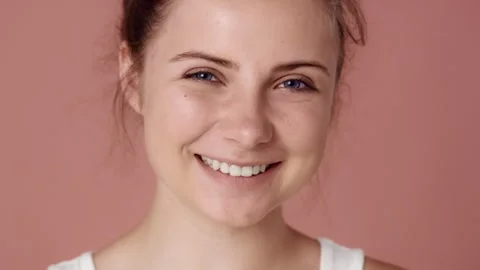 Close up portrait of fully smiling caucasian teenage woman Video stock 244699042