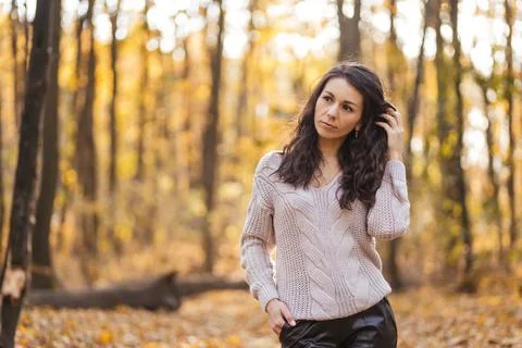 Close up Portrait of a funny brunette woman at the autumn forrest Stock Photos