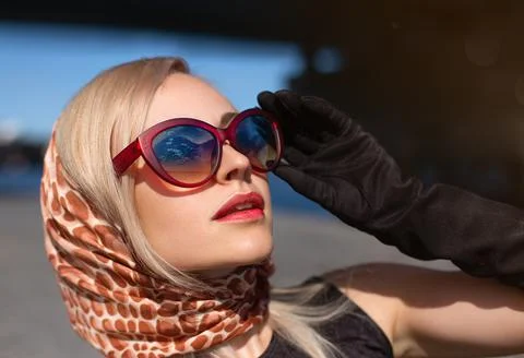 Close up portrait girl posing in the light of autumn sun. Stock Photos