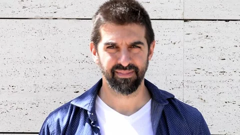 Close-up portrait of good-looking bearded guy in stylish clothing standing ou Stock Footage 135638406