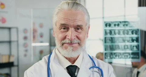 Close up portrait of good-looking positive experienced respected grey-haired Stock Footage 160422824