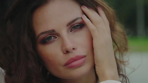 Close-up portrait of Gorgeous elegant young woman looking at camera. Stock Footage 161564152