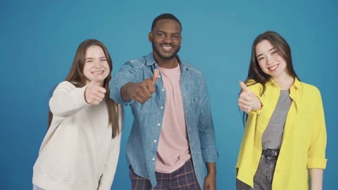 Close-up portrait of group of friends of different races. Smile and approve. 動画素材 228810966