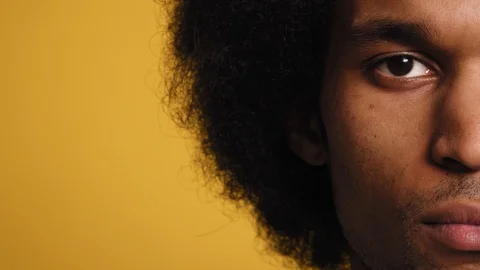 Close up portrait of half face of African man. Video stock 128966732