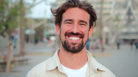 Close up portrait of handsome bearded guy with perfect white teeth smiling and Stock Footage 243678796
