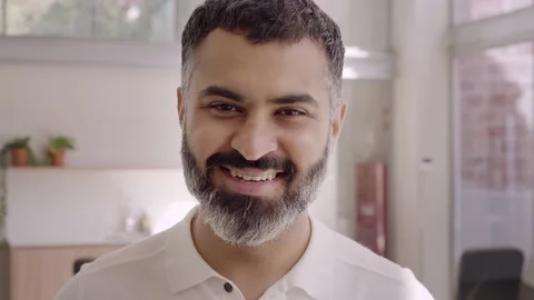 Close-up portrait of handsome bearded Indian businessman company employee Stock Footage 207239622