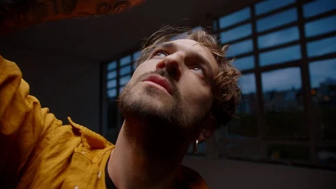 Close up portrait of handsome guy performance moving hands gently touching head Stock Footage 109365805