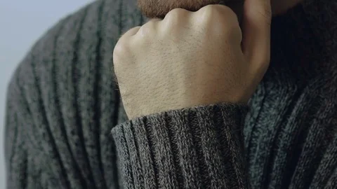 Close-up portrait of handsome man leans on his hand and looking at camera Stock Footage