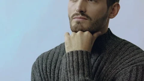 Close-up portrait of handsome man leans on his hand and looking at camera 스톡 동영상 80921945