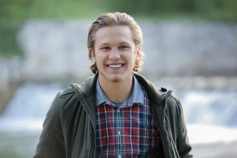 Close-up portrait of handsome young man, outdoor Stock Photos