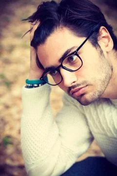 Close portrait of a handsome young man with glasses outdoor. Attractive and c Stock-Fotos