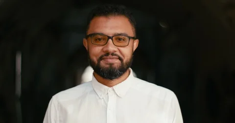 Close-up portrait of the happy african man in eyeglasses happily smiling at Stock Footage 91730341