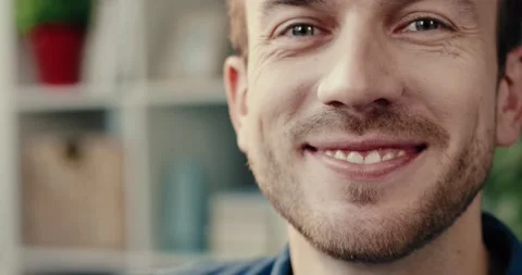 Close up portrait of happy bearded man with green eyes smiling looking at camera Stock Footage 148928613