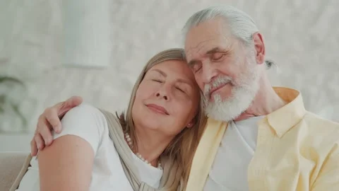 Close up portrait of the happy elderly couple smiling and hugging relaxing at Vídeos de archivo 224530694