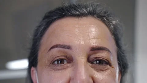 Close-up portrait of happy middle-aged woman looking on camera in beauty salon Stock Footage 156654055