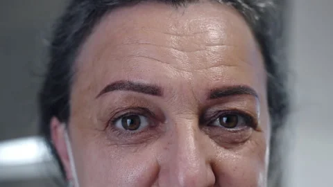 Close-up portrait of happy middle-aged woman looking on camera in beauty salon Stock Footage 162473282